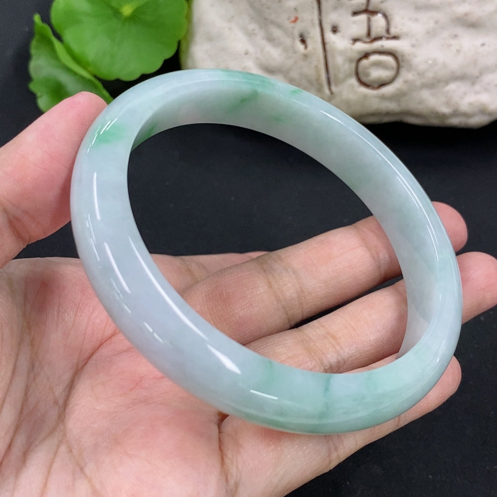 HKHQ jadeite round bracelet weighing approximately 59.8g with a 63.5mm size, featuring smooth, polished jadeite beads.