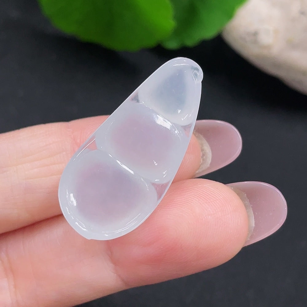 Huiliu Jadeite Lucky Bean Pendant featuring smooth green jade, certified by Huiliu HQ, hanging on a delicate cord.