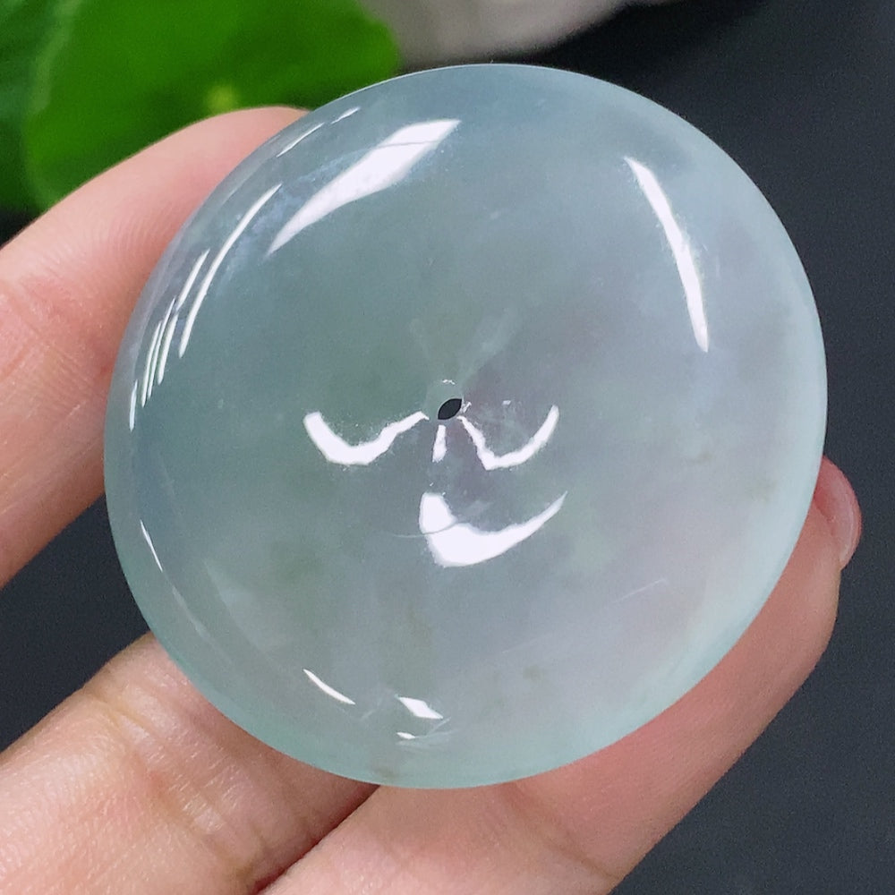 Jadeite pendant featuring a Peace Knot design, crafted by HUILIU HQ, showcasing smooth green jade with intricate knot details.