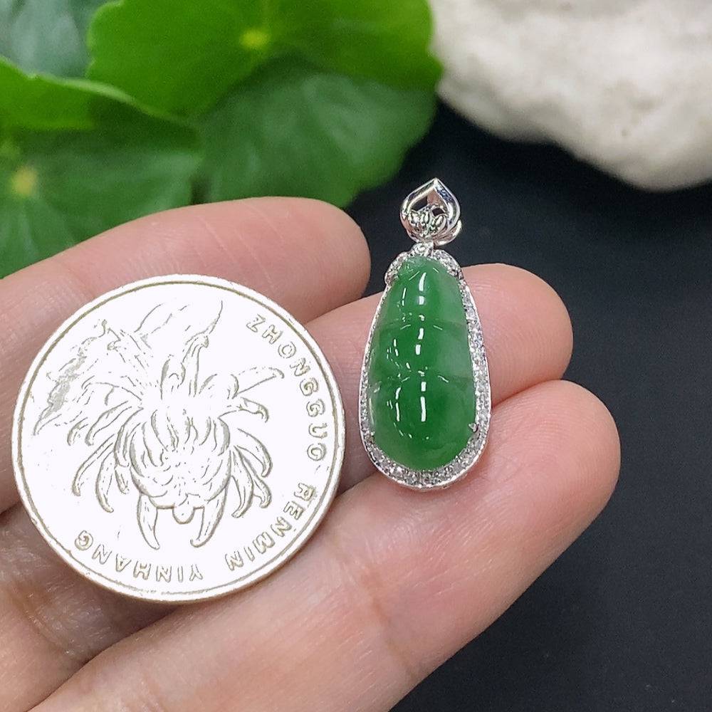 Jadeite lucky bean pendant in 18K gold with diamond accents, featuring a smooth green jade stone and delicate gold detailing.