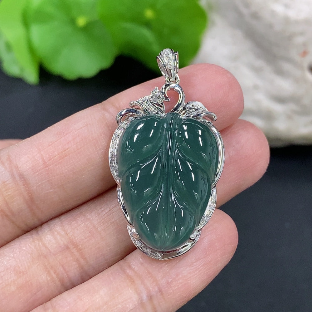 Jadeite leaf inlay pendant with 18K gold and diamond accents, elegant necklace featuring intricate craftsmanship.