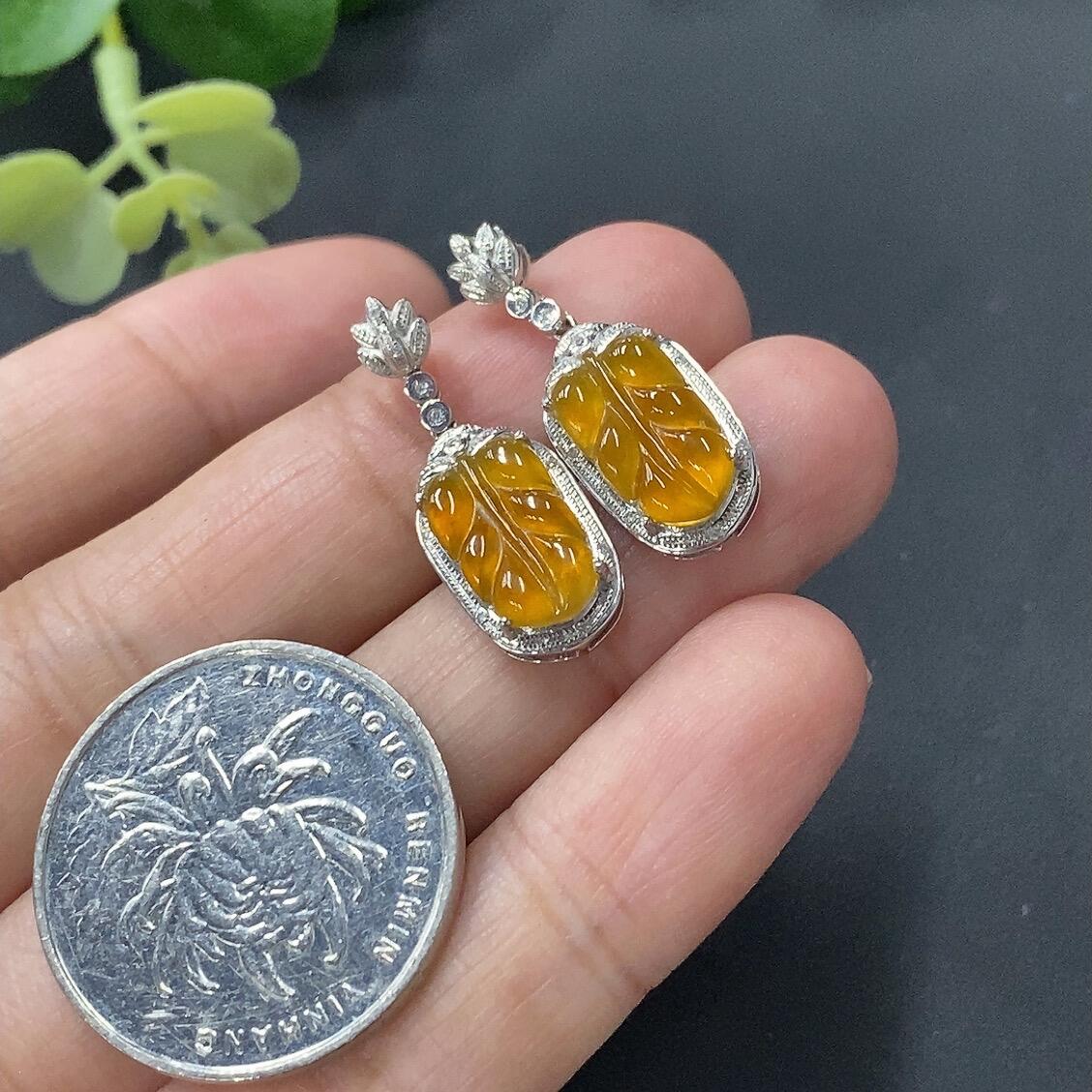 A pair of 18K gold inlaid jade earrings, total weight 3 grams