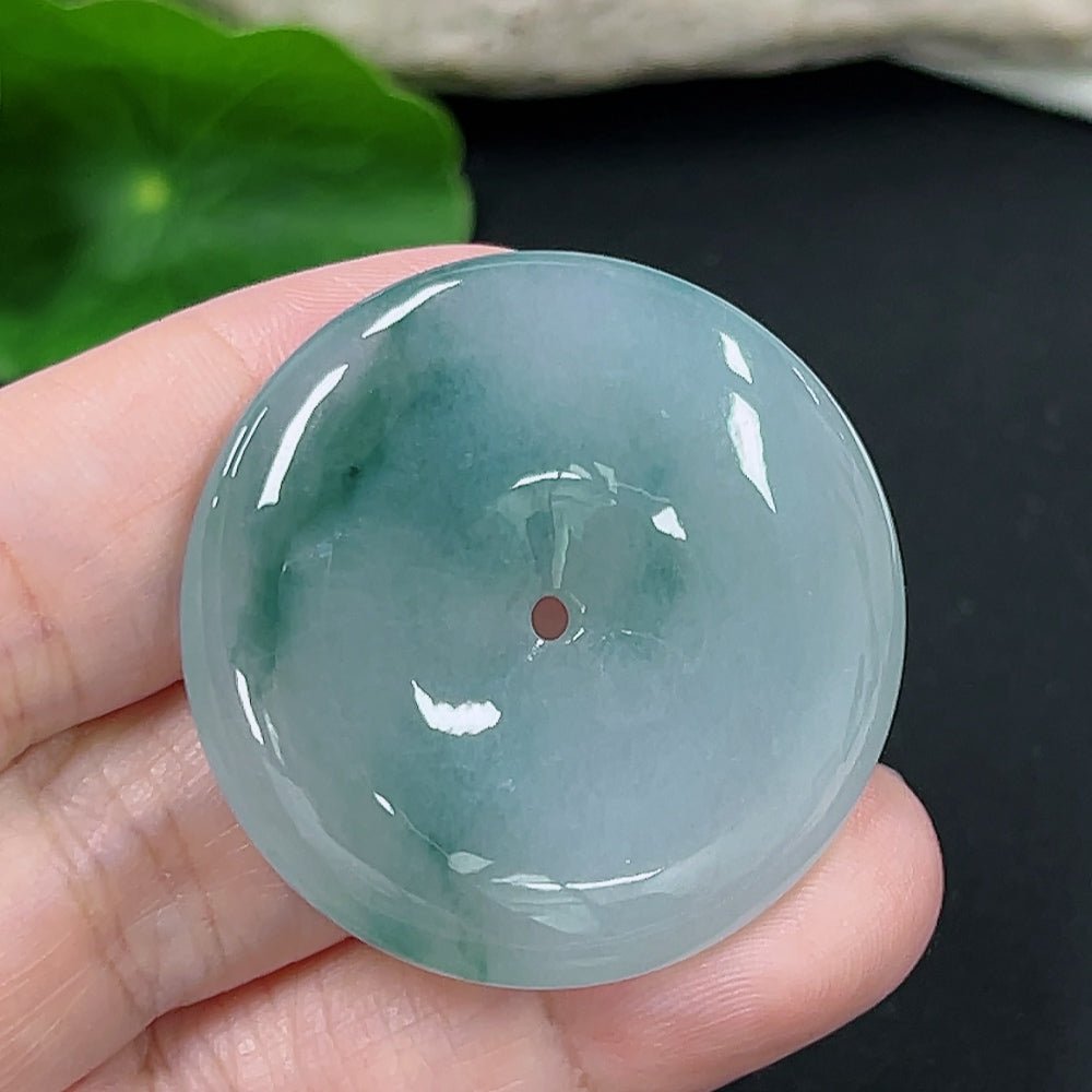 Jadeite Peace Knot pendant with intricate design, weighing approximately 18.9g, crafted by HKHQ, showcasing smooth green jade surface