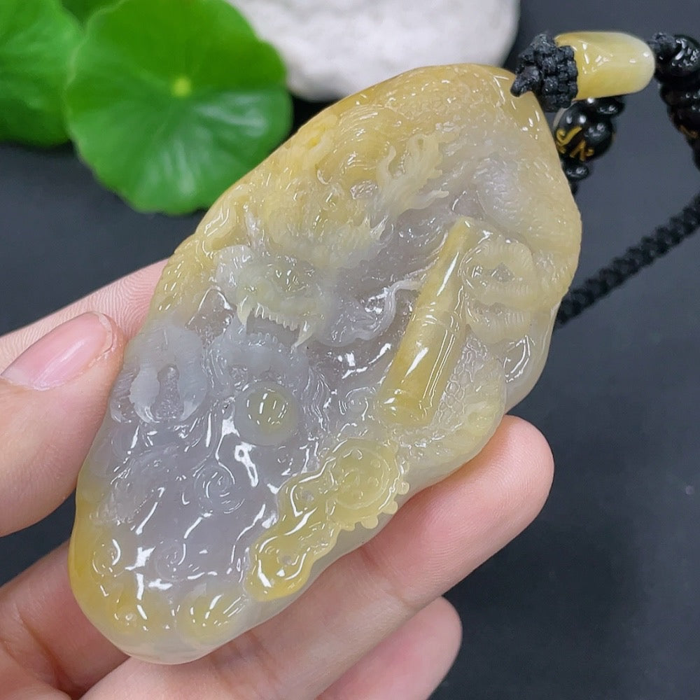 Jadeite dragon pendant with a total weight of approximately 70.5g including the cord (matching beads are non-A)