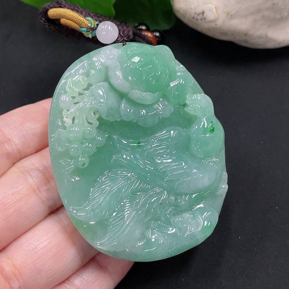 Huiliu Jadeite Phoenix and Peony Pendant featuring intricate carved design and vibrant green jade, crafted by HUILIU HQ.