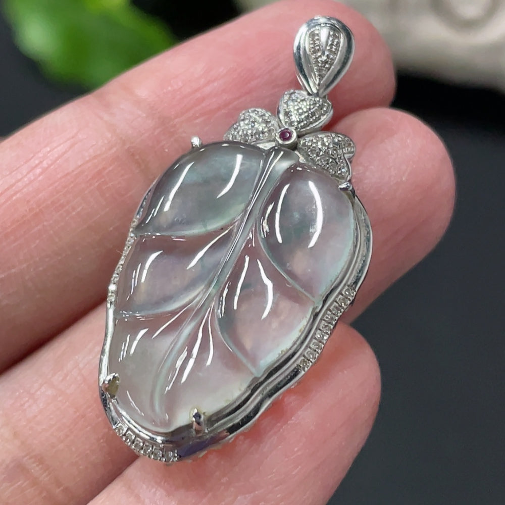 Jadeite leaf inlay pendant with 18K gold and diamond accents, showcasing a detailed jade jadeite leaf design with elegant gold setting.