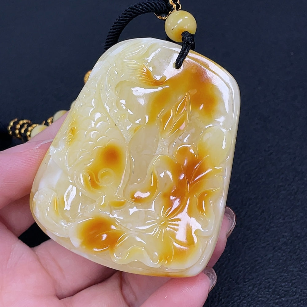Amber beeswax pendant with colorless coating and rope, weighing approximately 35.08g, from HKHQ gemstone jewelry.