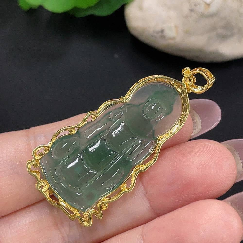 Jadeite Buddha pendant with 18K gold setting, weighing about 5.9g, featuring a detailed Buddha figure on a jade pendant.