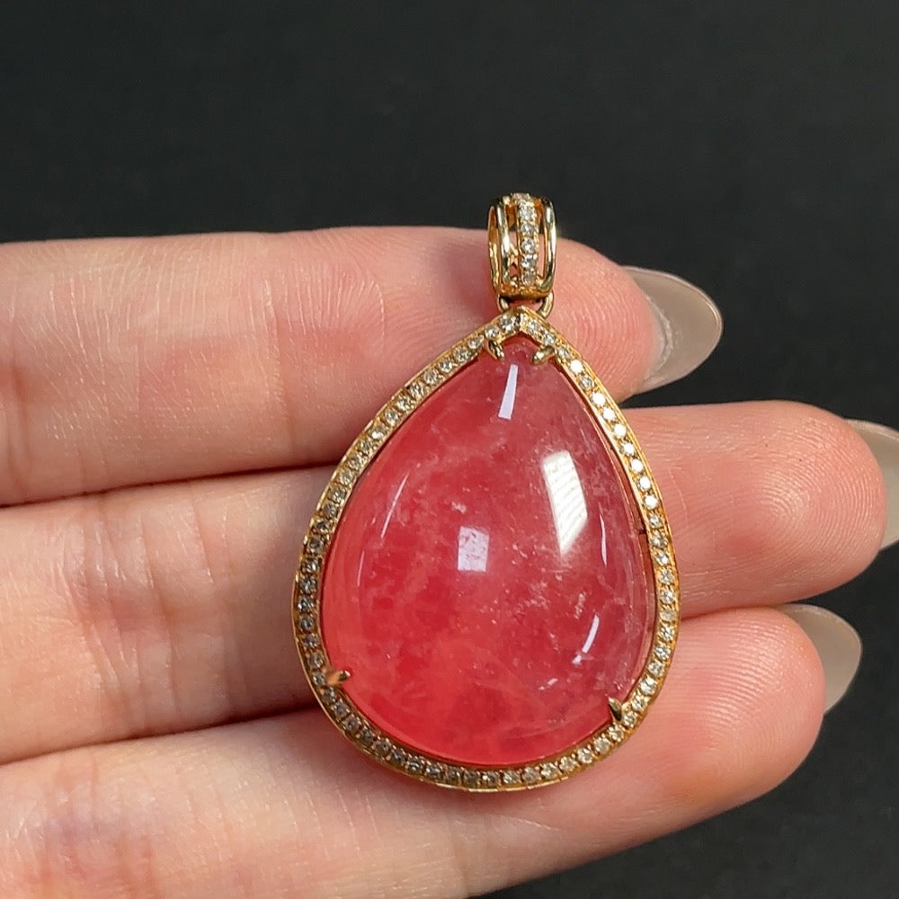 Rhodochrosite pendant with 18K gold and diamond accents, showcasing organic matter, weighing approximately 10.53 grams.