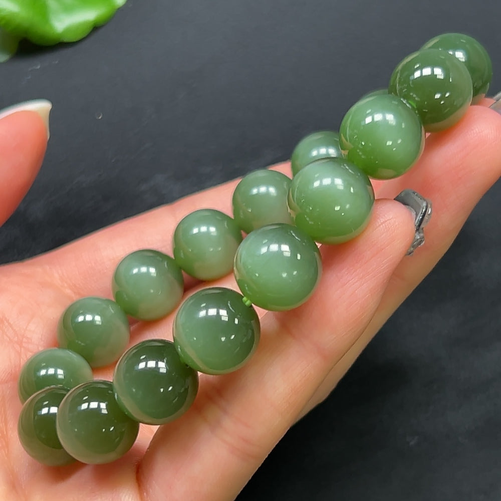 Hetian Jade bracelet by HKHQ featuring 11.8mm smooth, polished jade beads on a classic jewelry bracelet style.