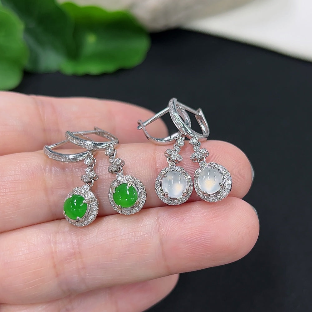 Elegant jadeite inlaid earrings with diamond accents in 18K gold, featuring intricate craftsmanship and sparkling details.