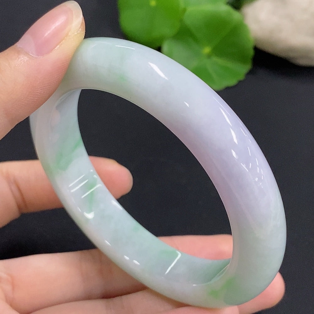 HKHQ jadeite round bangle in size 58.9 with a polished finish, weighing 76.08g, displayed on a plain background.