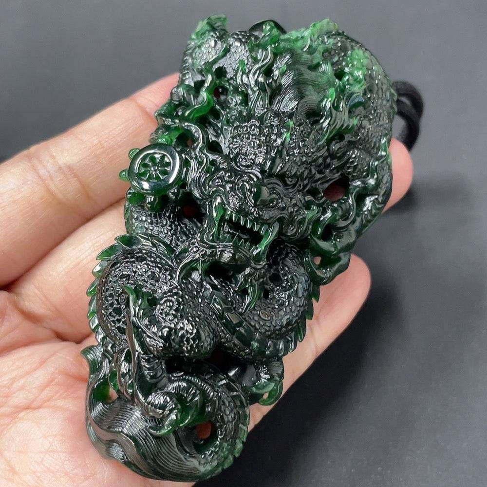 Huiliu Jadeite Dragon Pendant featuring a detailed green jade dragon design on a polished jade surface.