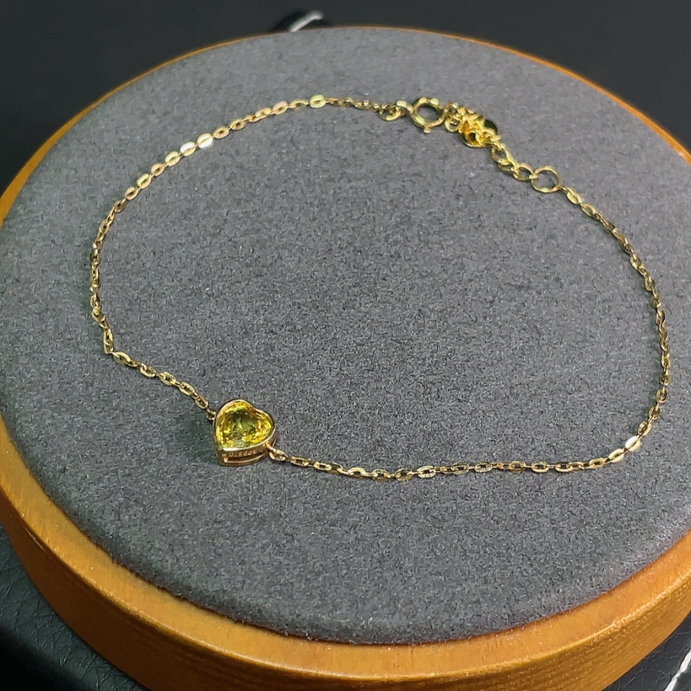 HKHQ sapphire inlaid bracelet with 18k gold, featuring vibrant blue sapphires and delicate gemstone details.