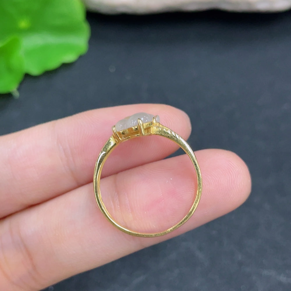 Elegant Jadeite ring with 18K gold and diamond side stones, showcasing a smooth jadeite gemstone set in a polished gold band.