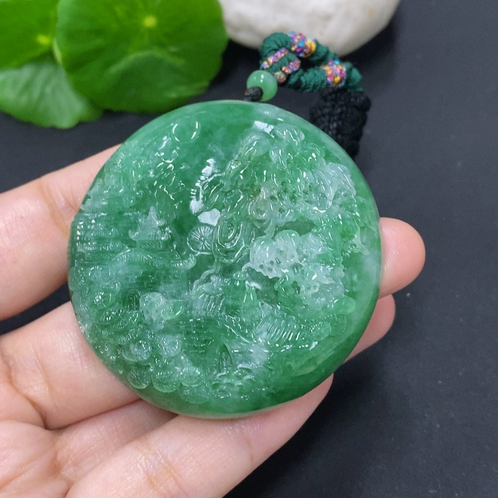 Jadeite landscape pendant necklace with cord, weighing approximately 66.1g, featuring intricate jadeite carvings by HKHQ.