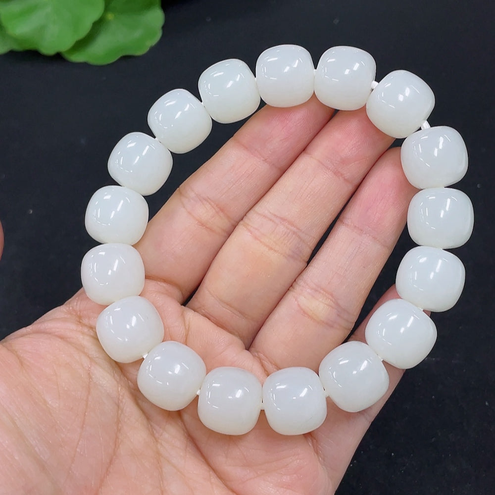 HKHQ Hetian Jade bracelet weighing 60.5g featuring smooth, polished jade beads arranged in a stylish bracelet design.