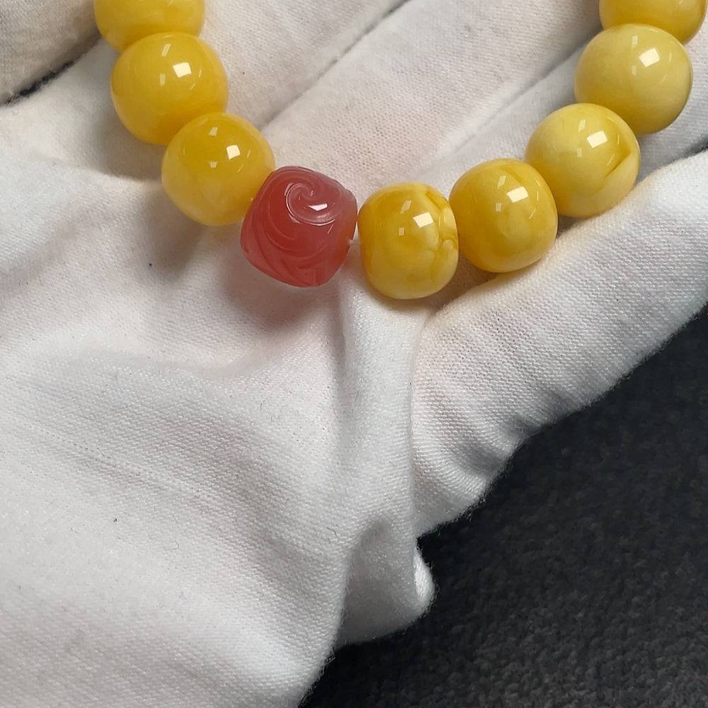 Amber beeswax bracelet with southern red agate beads, crafted by HUILIU HQ, featuring natural amber and vibrant red stones.