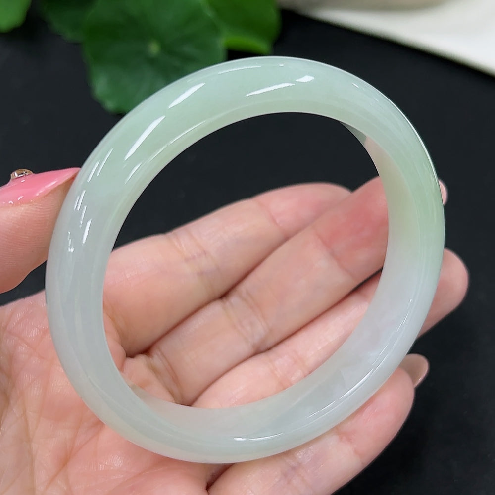 HKHQ jadeite round bangle in size 56, weighing 46.3g, showcasing smooth, polished green jadeite jewelry.