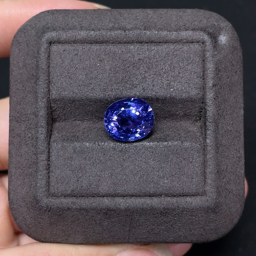 4.45-carat tanzanite loose gemstone from HKHQ, showcasing vibrant blue-violet color and clarity in a jewelry setting.