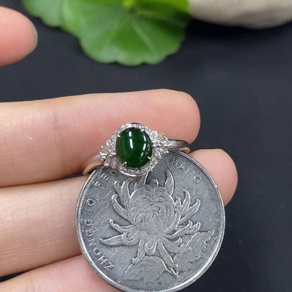 HUILIU HQ jadeite cabochon ring with diamond accents, showcasing a polished green jade gemstone and sparkling diamond details.