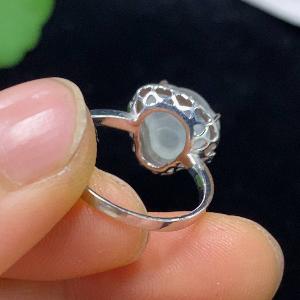 Huiliu Jadeite ring set with diamond accents, showcasing a polished green jade piece in a luxurious jewelry design.