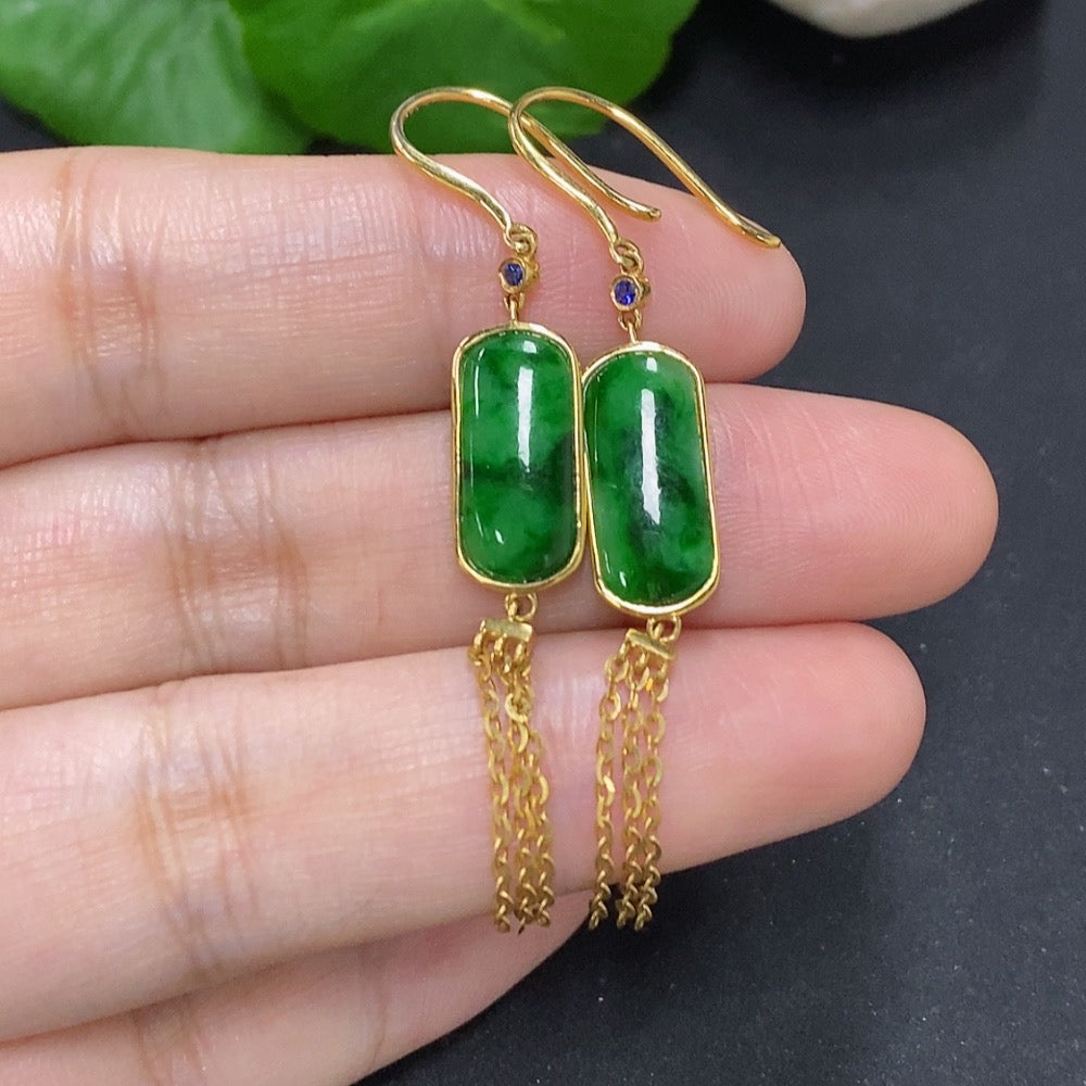 Elegant jadeite earrings with 18K gold settings, featuring smooth, polished green jade stones in a sophisticated jewelry design.