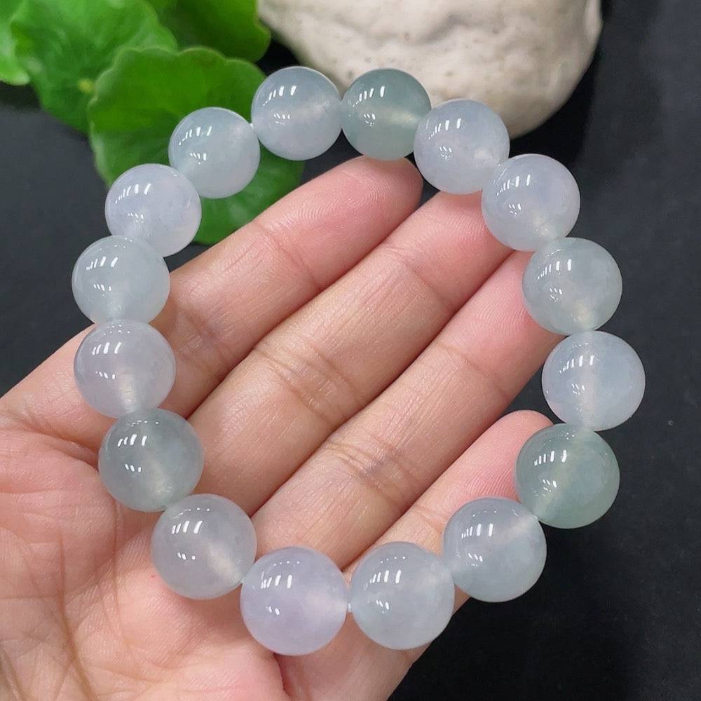 HUILIU HQ jadeite bracelet with 12mm beads, approximately 47.72 grams, showcasing smooth, polished jade stones on a flexible string.