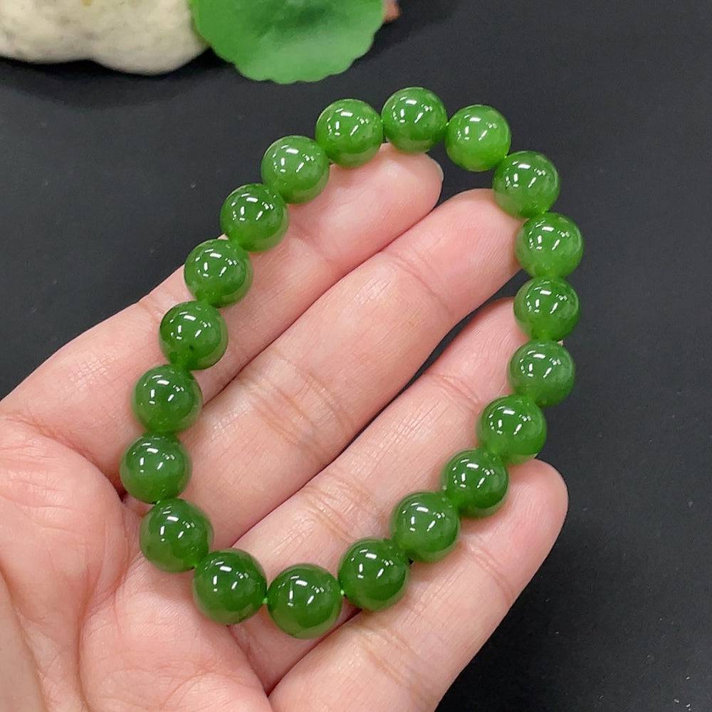 Hetian jade bracelet by HUILIU HQ with 9.5mm beads, weighing approximately 28.6g, showcasing smooth, polished jade stones.