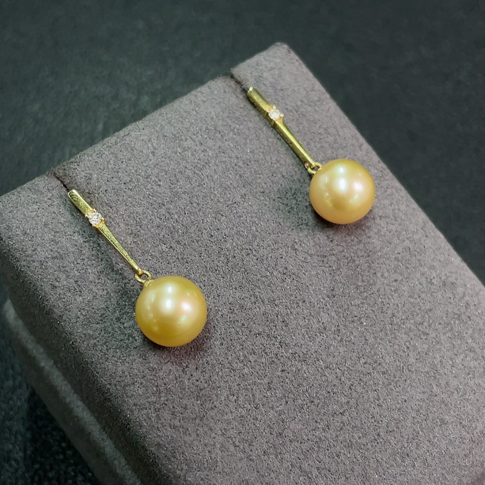 Seawater Pearl Earrings Set in 18K Gold, Approx. 9.2mm, Total Weight About 3.60g, Color Origin Undetermined, Accented with Diamonds