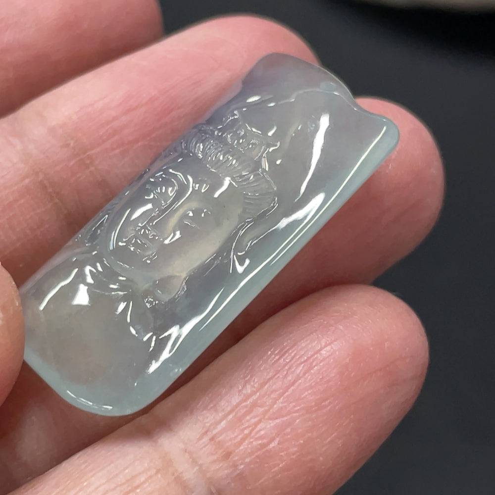 Jadeite Guanyin pendant from HUILIU HQ, carved jade figure weighing approximately 6.2 grams, showcasing detailed craftsmanship.
