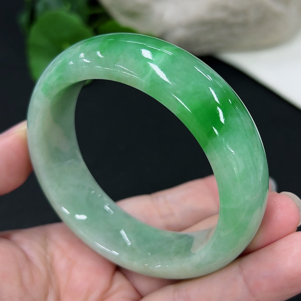 Round jadeite bangle with size 53.6 and weight 82.02g, showcasing smooth, polished green jade from HKHQ.