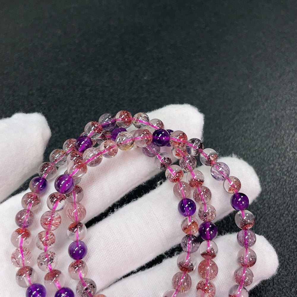 Huiliu certified gemstone crystal bead strand, about 6.1mm, featuring polished, clear crystal beads for jewelry making.