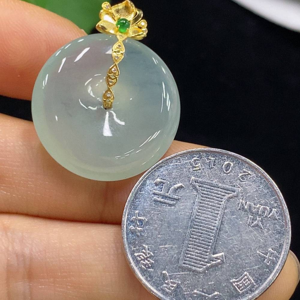 Huiliu Jadeite Peace Knot pendant, crafted from green jade, featuring a smooth, polished design with intricate knot detail.