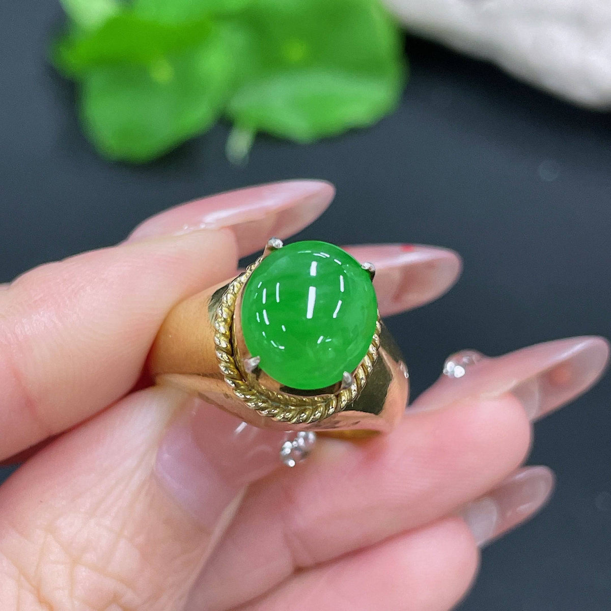 Jadeite cabochon from HUILIU HQ, smooth non-gold jade stone weighing approximately 12.26 grams, showcasing a polished, rounded surface.