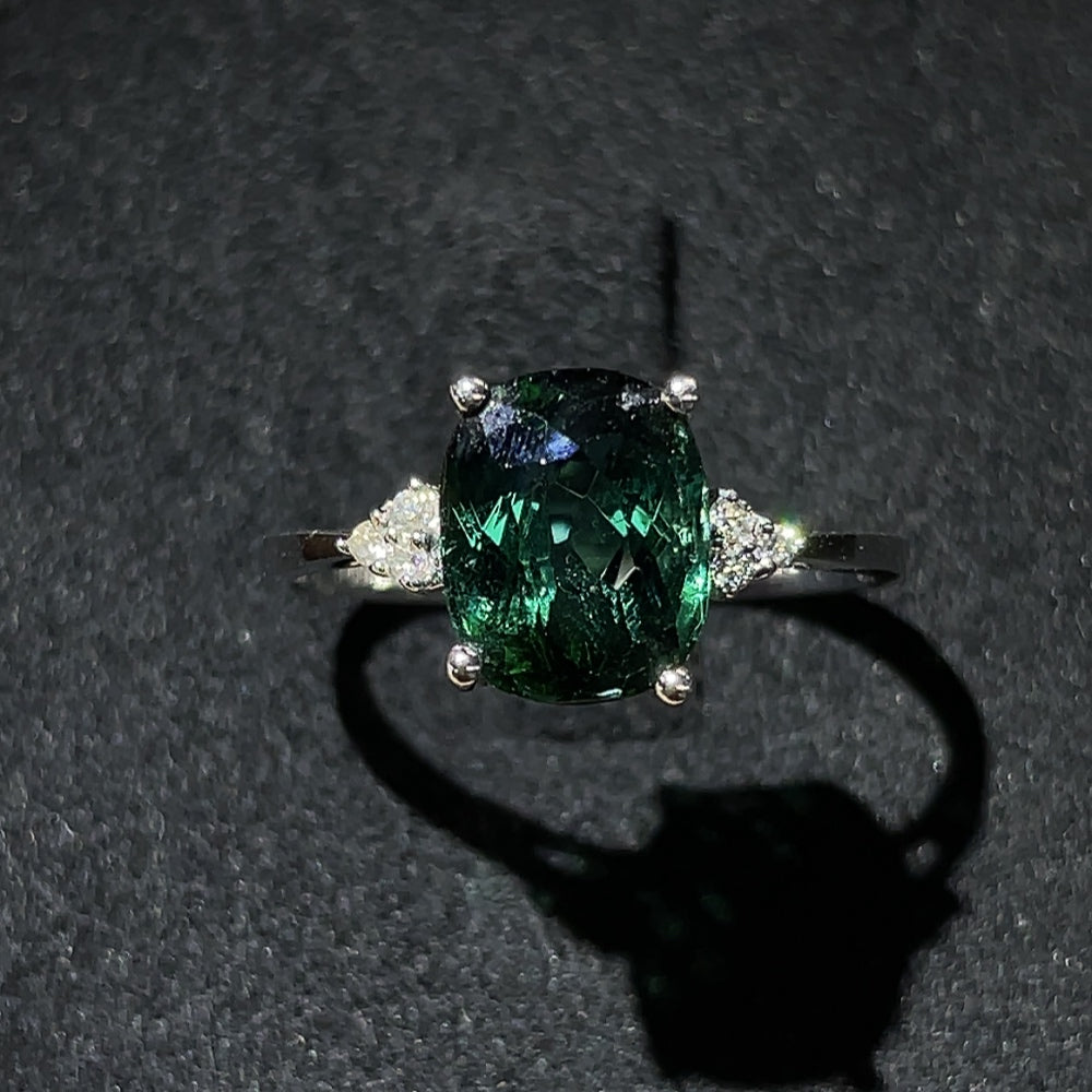 Tourmaline ring with gold setting and diamond accents, elegant jewelry piece by HKHQ featuring vibrant gemstone and sparkling details.