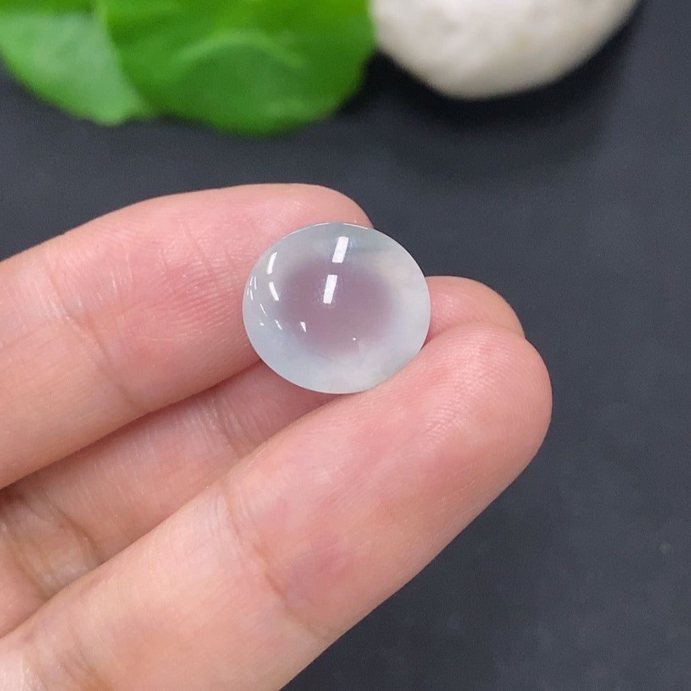 Jadeite cabochon jewelry piece from HKHQ, showcasing a smooth, polished green gemstone weighing 2.2 grams.