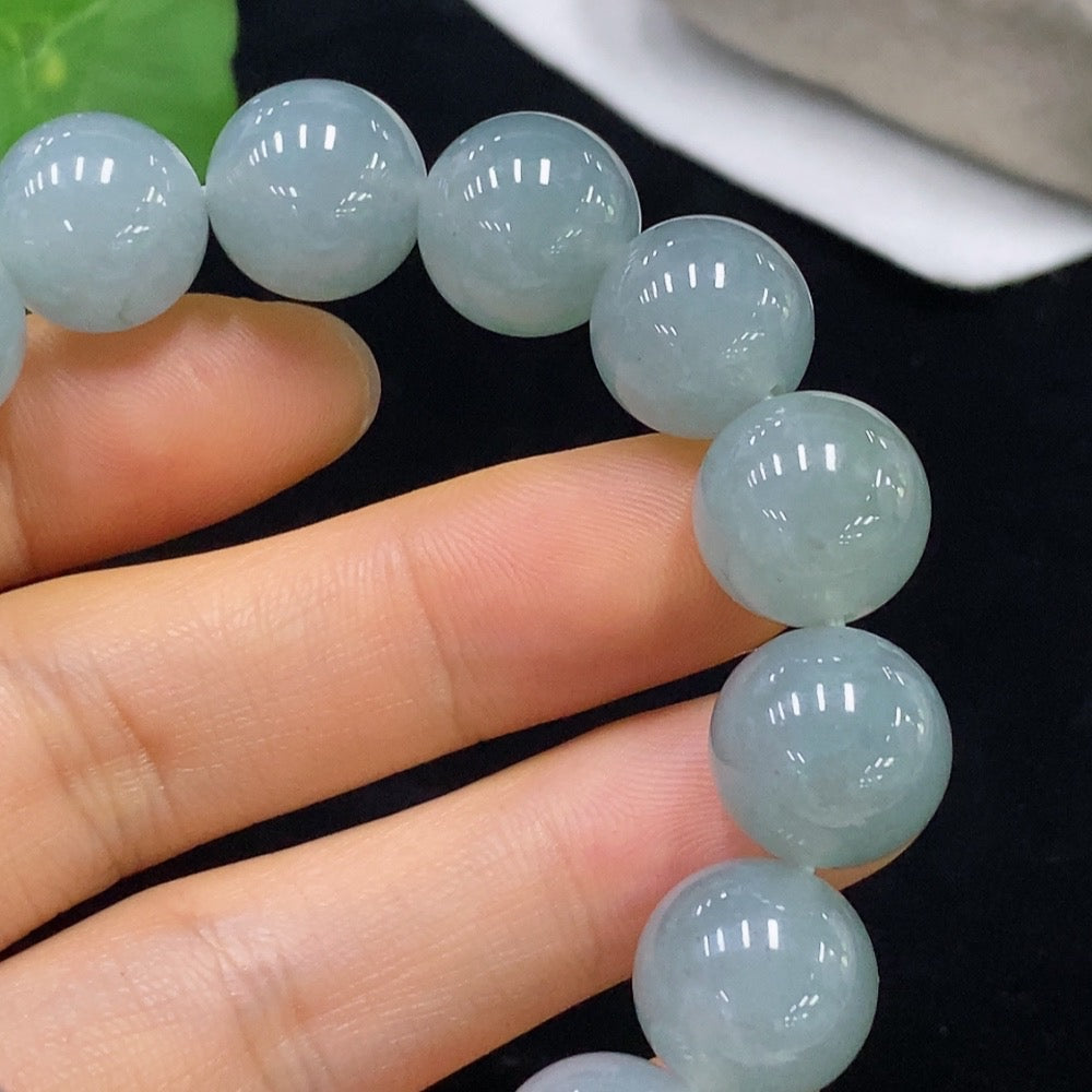 HUILIU HQ jadeite bracelet with 13mm beads, showcasing smooth, polished green jade stones and a total weight of 58.13 grams.