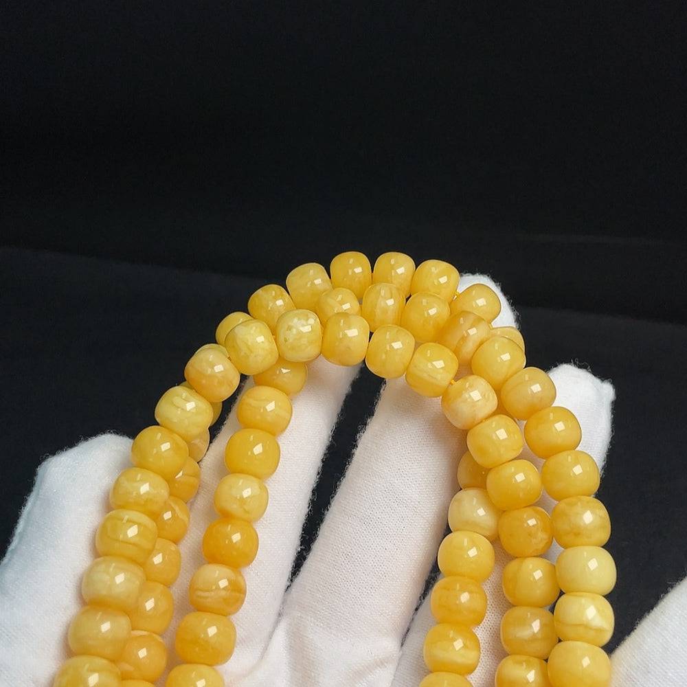 Amber Beeswax Bead Necklace by HUILIU HQ featuring 8.8mm amber beads, total weight approx. 45.64g, displayed on a neutral background.