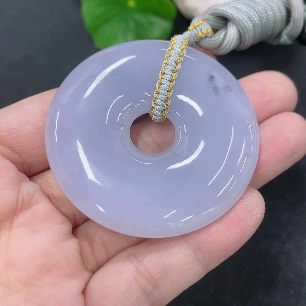 Jadeite pendant donut with rope, weighing approximately 42.54g, featuring vibrant green jade and intricate craftsmanship.