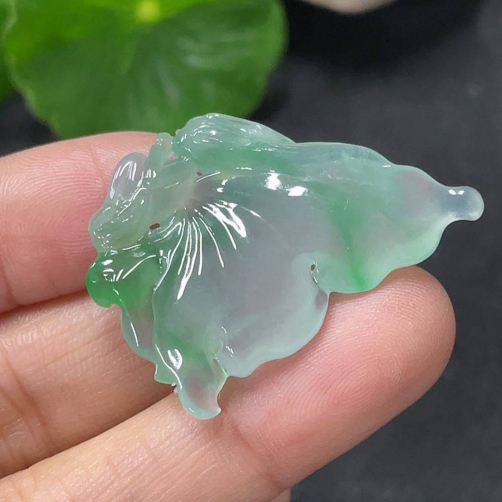 Jadeite pendant featuring a butterfly fairy design by HUILIU HQ, showcasing a detailed green jade figure on a delicate cord.