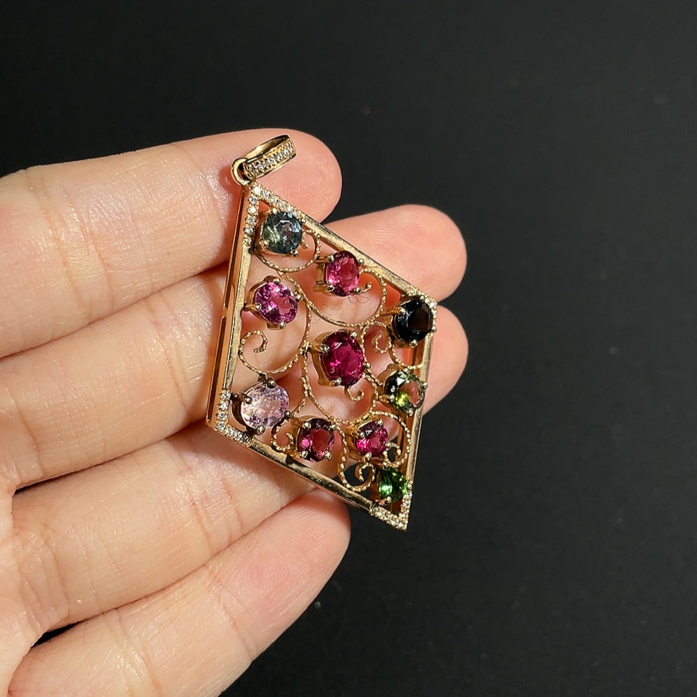 Tourmaline pendant with spinel (light purple, gray blue) and diamond accents, 18k gold