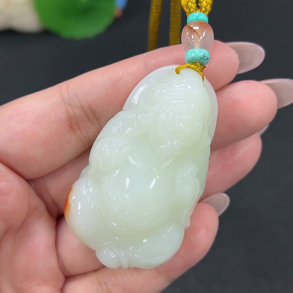 Hetian jade pendant featuring the God of Wealth, crafted from green jade with a rope, weighing approximately 64.7g.