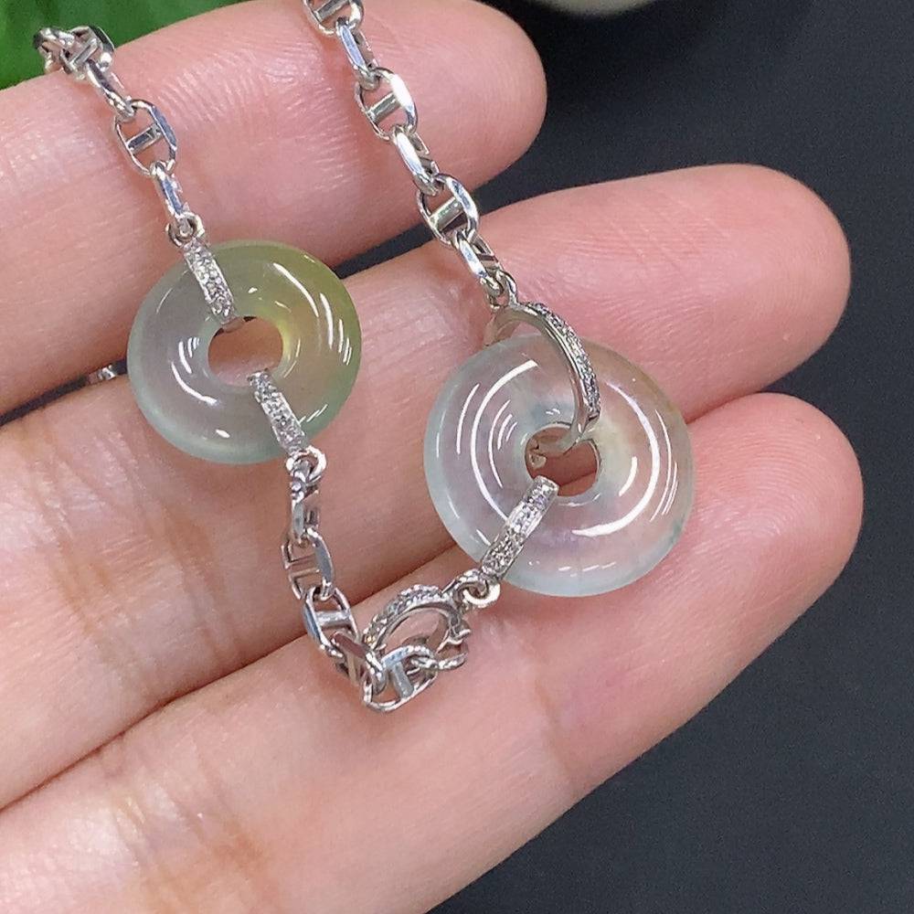Jadeite safety buckle necklace with 18K gold and diamond accents, featuring a jade pendant and gold chain.