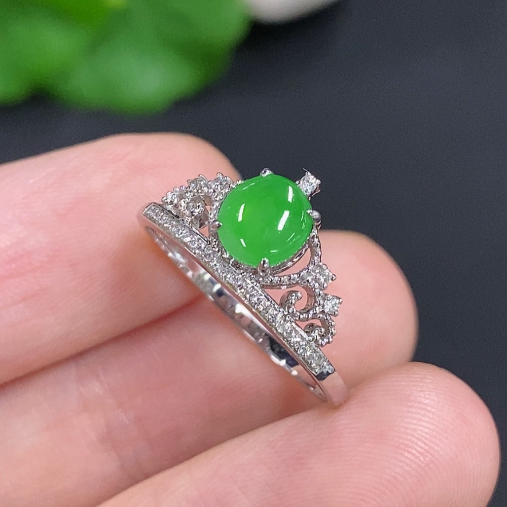 Jadeite cabochon ring with diamond accents in 18k gold, size 15, featuring a smooth jade gemstone and delicate gold setting.