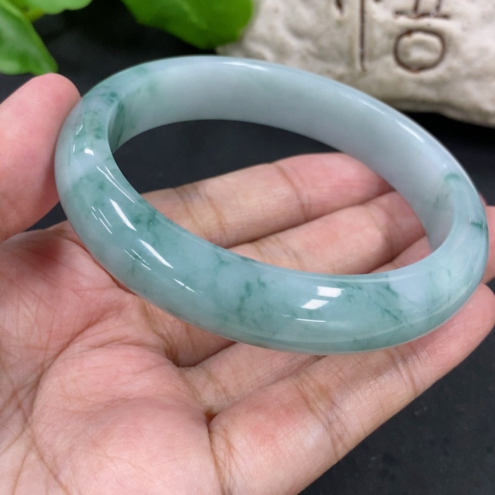 HKHQ jadeite round bangle with 59.2mm diameter and 57.62g weight, smooth green jade jewelry on a neutral background.