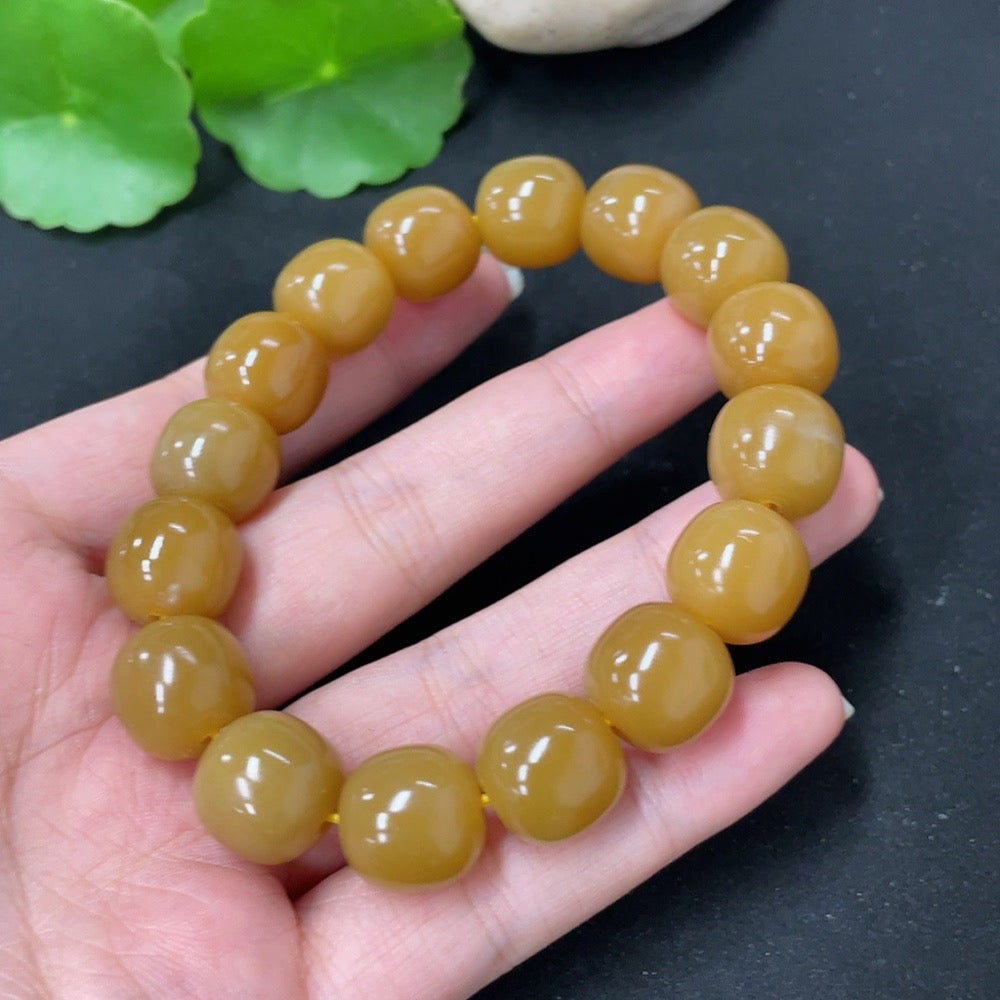 HKHQ Hetian jade bracelet, 58.5g, featuring smooth, polished green jade beads on a delicate string.