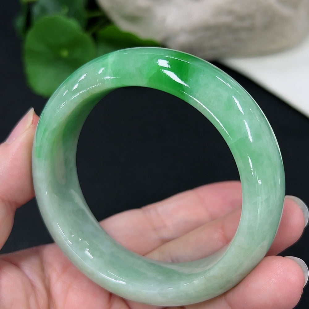 Jadeite round bangle with size 53.6, weight 82.02g, showcasing smooth, polished green jadeite from HKHQ.