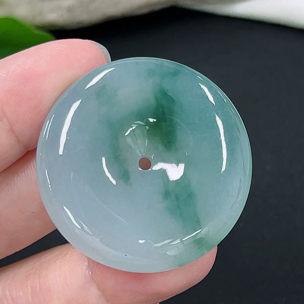 Jadeite Peace Knot pendant from HKHQ, handcrafted jade necklace featuring a smooth, polished peace knot design.