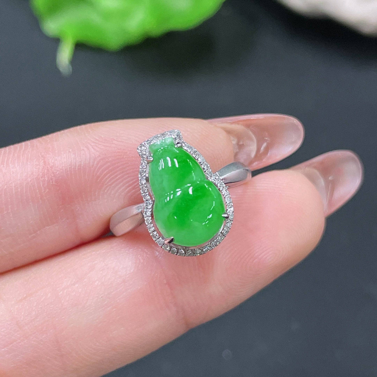 HUILIU HQ jadeite ring set in 18k gold with diamonds, size 11, featuring a polished jade gem and sparkling diamond accents.